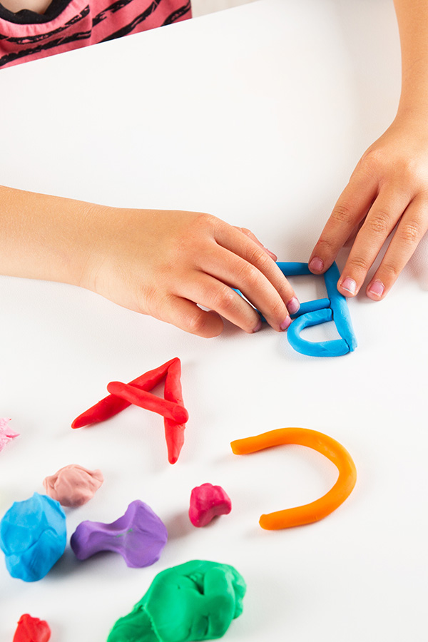 Make spelling words with playdough snakes